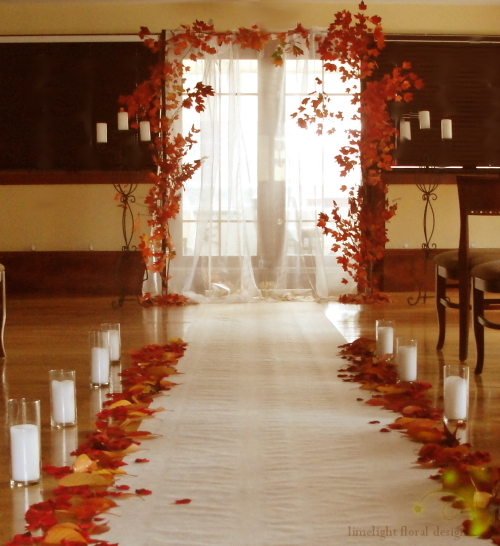 Autumn wedding arch indoors A square arch framed with autumn maple leaves