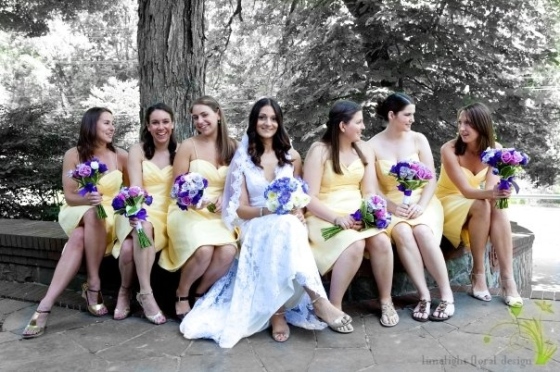 Bridesmaids in yellow dresses with lavander purple flowers