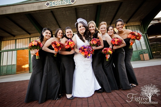 Liberty House Restaurant wedding flowers bridesmaids in black dress with orange flower bouquets