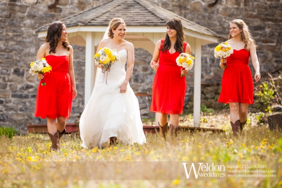 Bridal party bridesmaids with yellow flower bouquets in red dresses. Weldon Photography